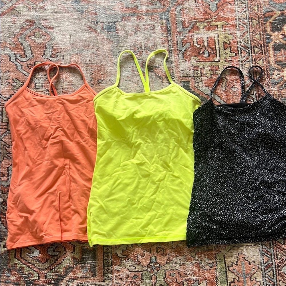 Lululemon shelf bra tanks- Orange, Yellow, and patterned Black. Size 6 Lot of 3